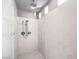 All-tile shower with dual shower heads and built in cubbies at 6484 Mount Eden Ave, Las Vegas, NV 89139