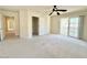 Expansive bedroom with a ceiling fan, closet, and sliding door to a private balcony at 6625 Gossamer Fog Ave, Las Vegas, NV 89139