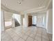 Open foyer with tile flooring, grand staircase, and ample natural light at 6625 Gossamer Fog Ave, Las Vegas, NV 89139