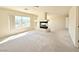 Spacious carpeted living room with fireplace at 6625 Gossamer Fog Ave, Las Vegas, NV 89139