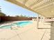 Private backyard oasis featuring a sparkling pool, spa, and covered patio at 6625 Gossamer Fog Ave, Las Vegas, NV 89139