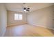 This bedroom features light-colored wood floors and a modern ceiling fan at 6649 W Tropicana Ave # 101, Las Vegas, NV 89103