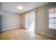 Bright dining area featuring neutral walls, a large sliding glass door, and tile flooring at 6649 W Tropicana Ave # 101, Las Vegas, NV 89103