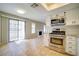 View of updated kitchen with stainless appliances and tan flooring at 6649 W Tropicana Ave # 101, Las Vegas, NV 89103