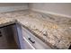 Close up of kitchen countertop with white cabinets and stylish granite at 6649 W Tropicana Ave # 101, Las Vegas, NV 89103