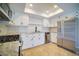 Charming kitchen boasts white cabinets, stainless steel appliances, and a modern aesthetic at 6649 W Tropicana Ave # 101, Las Vegas, NV 89103