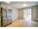 Eat-in kitchen featuring stainless steel appliances and sliding glass doors for ample natural light at 6649 W Tropicana Ave # 101, Las Vegas, NV 89103