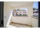 The patio overlooks the complex with a view of the building and mature trees at 6649 W Tropicana Ave # 101, Las Vegas, NV 89103