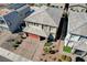 Two-story home featuring a red garage door, desert landscaping, and a tile roof in a residential neighborhood at 6790 Tangled Vines Ave, Las Vegas, NV 89139