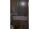 Bathroom featuring a shower and vanity, with aged features and surfaces needing renovation at 709 G St, Las Vegas, NV 89106