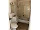Bathroom featuring a shower-tub combo, vanity, and toilet in disrepair at 709 G St, Las Vegas, NV 89106