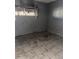 Damaged bedroom with dirty tile floors and peeling paint is in poor condition at 709 G St, Las Vegas, NV 89106