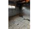 Damaged bedroom with graffiti and holes in the floor, requiring repairs at 709 G St, Las Vegas, NV 89106