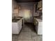Outdated kitchen with worn cabinets and stained countertops, awaiting renovation at 709 G St, Las Vegas, NV 89106