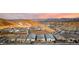 Aerial view of a modern desert community, showcasing mountain views and new homes at 76 Tatahatso Point St, Henderson, NV 89011