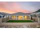 Backyard featuring a covered patio and artificial grass at 76 Tatahatso Point St, Henderson, NV 89011
