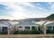 Well-maintained backyard with artificial turf, covered patio, and mountain views at 76 Tatahatso Point St, Henderson, NV 89011