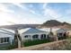 Desirable outdoor living space with covered patio and low-maintenance artificial turf at 76 Tatahatso Point St, Henderson, NV 89011