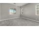 Clean bedroom with neutral walls and plush carpet, offering a calming and comfortable atmosphere at 76 Tatahatso Point St, Henderson, NV 89011