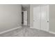 This bedroom is painted a neutral color with soft carpeting, and double door closet access at 76 Tatahatso Point St, Henderson, NV 89011