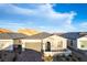 Charming single-story home with an attached garage, well-manicured landscaping, and a welcoming entrance at 76 Tatahatso Point St, Henderson, NV 89011
