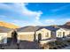 Beautiful home with a stone-accented facade, a two-car garage, and a well-maintained front yard at 76 Tatahatso Point St, Henderson, NV 89011