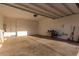 Spacious garage with ample room for parking and storage, with an access door to the house at 76 Tatahatso Point St, Henderson, NV 89011