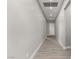 Bright hallway with recessed lighting and wood-style floors leads into the home at 76 Tatahatso Point St, Henderson, NV 89011