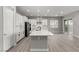 Beautiful kitchen with white cabinets, stainless steel appliances, and large island at 76 Tatahatso Point St, Henderson, NV 89011