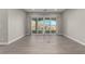 Spacious living room with tile floors and patio access through sliding glass doors at 76 Tatahatso Point St, Henderson, NV 89011