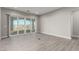 Open living room with tile floors and sliding glass doors to outdoor patio at 76 Tatahatso Point St, Henderson, NV 89011