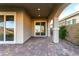 Relaxing covered patio with paved flooring, perfect for entertaining or enjoying the outdoors at 76 Tatahatso Point St, Henderson, NV 89011