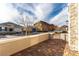 Street view showcasing desert mountain views, well-maintained landscaping, and block wall features at 76 Tatahatso Point St, Henderson, NV 89011