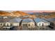 View of a neighborhood of modern homes with desert landscaping and mountain backdrop at 76 Tatahatso Point St, Henderson, NV 89011