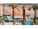 An aerial view of a home featuring a clay tile roof and backyard with a pool at 7641 Jacaranda Bay St, Las Vegas, NV 89139