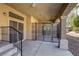 Covered back patio with security gate offering a relaxing outdoor space at 7641 Jacaranda Bay St, Las Vegas, NV 89139