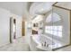 Bright primary bath with dual sinks, soaking tub, walk-in shower, and walk-in closet at 7641 Jacaranda Bay St, Las Vegas, NV 89139