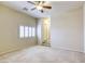 Bedroom featuring carpet flooring, shuttered windows, ceiling fan, and closet storage at 7641 Jacaranda Bay St, Las Vegas, NV 89139