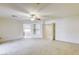Spacious carpeted bedroom with ceiling fan and adjoining bathroom with separate tub at 7641 Jacaranda Bay St, Las Vegas, NV 89139