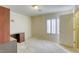 Bedroom with a modern window with shutters, neutral walls and carpet, built in desk and attached closet at 7641 Jacaranda Bay St, Las Vegas, NV 89139