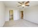 Bedroom with a ceiling fan and easy access to both the closet and hall at 7641 Jacaranda Bay St, Las Vegas, NV 89139