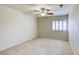 Bright bedroom featuring a ceiling fan and a window with white shutters at 7641 Jacaranda Bay St, Las Vegas, NV 89139