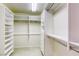 Spacious closet with custom shelving, drawers and ample storage capacity at 7641 Jacaranda Bay St, Las Vegas, NV 89139