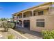 Two story home featuring a spacious covered patio and balcony with a low maintenance yard at 7641 Jacaranda Bay St, Las Vegas, NV 89139