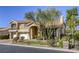 Stunning two-story home featuring a terracotta roof, manicured landscaping, and a three-car garage at 7641 Jacaranda Bay St, Las Vegas, NV 89139