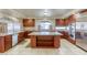 Beautiful kitchen features custom cabinets, a large kitchen island, and stainless steel appliances at 7641 Jacaranda Bay St, Las Vegas, NV 89139