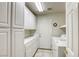 Laundry room featuring washer and dryer with lots of cabinet storage and counterspace at 7641 Jacaranda Bay St, Las Vegas, NV 89139