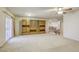Large living room featuring carpeting, ceiling fan, balcony access and large built in unit at 7641 Jacaranda Bay St, Las Vegas, NV 89139