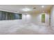Spacious living room featuring neutral carpeting, recessed lighting and large window with floor length curtains at 7641 Jacaranda Bay St, Las Vegas, NV 89139
