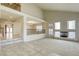 Spacious living room with vaulted ceilings, a fireplace, and ample natural light at 7641 Jacaranda Bay St, Las Vegas, NV 89139